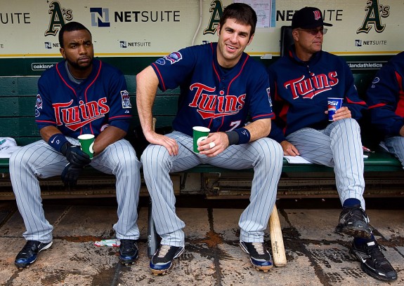 JOE MAUER #7 of the Minnesota Twins gets ready in the dugout before ...