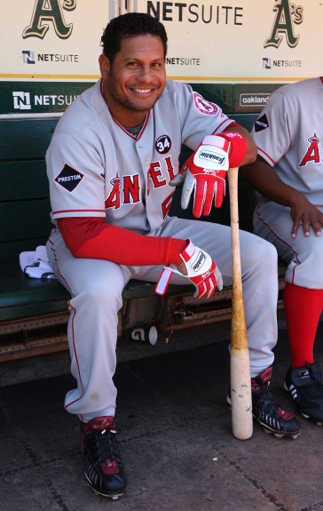 Bobby Abreu #53 of the Los Angeles Angels of Anaheim gets ready in the dugout before the game against the Oakland Athletics at the Oakland-Alameda County Coliseum on July 19, 2009 in Oakland, California.