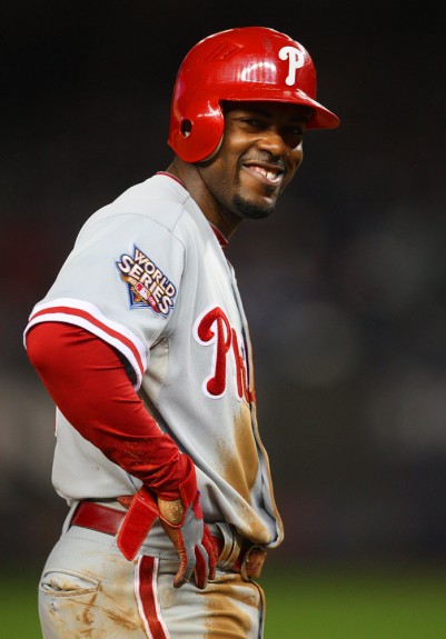 Philadelphia Phillies base runner Jimmy Rollins smiles while standing on third base during Game 1 of the World Series against the New York Yankees in New York. (Photo by Brad Mangin/MLB Photos)