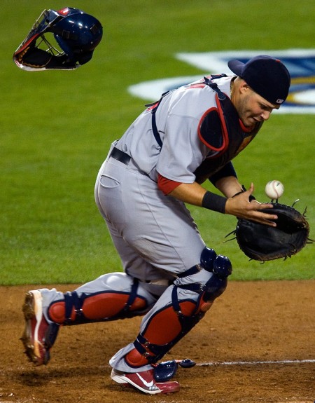 Yadier Molina of the St. Louis Cardinals makes a defensive play against the Los Angeles Dodgers during Game 1 of the National League Division Series at Dodger Stadium on October 7, 2009 in Los Angeles, California. (Photo by Brad Mangin)