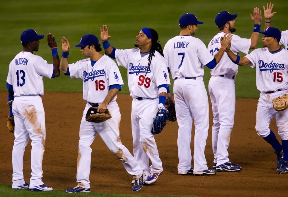 Manny Ramirez of the Los Angeles Dodgers celebrates with his teammates after Game 1 of the National League Division Series against the St. Louis Cardinals at Dodger Stadium on October 7, 2009 in Los Angeles, California. (Photo by Brad Mangin)