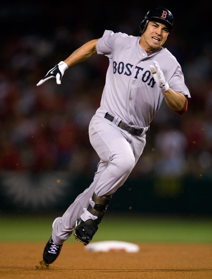 Jacoby Ellsbury of the Boston Red Sox runs the bases and legs out a triple against the Los Angeles Angels of Anaheim during Game 2 of the American League Division Series at Angel Stadium on October 9, 2009 in Anaheim, California. (Photo by Brad Mangin)