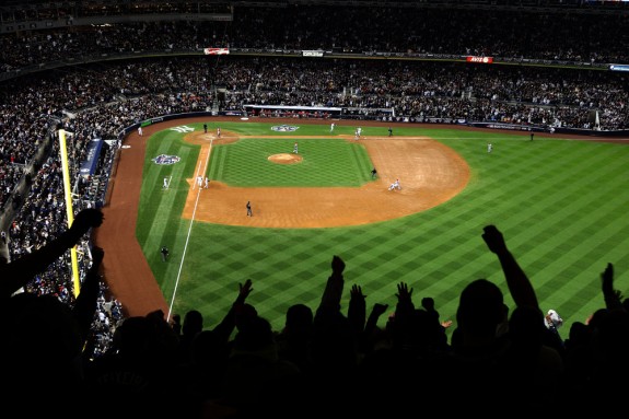 Overall interior view of Yankee Stadium showing fans cheering during Game 6 of the American League Championship Series between the Los Angeles Angels of Anaheim and the New York Yankees at Yankee Stadium in the Bronx, New York on October 25, 2009. The Yankees won 5-2 and clinched the American League pennant. (Photo by Brad Mangin)