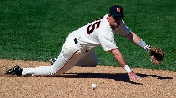 SAN FRANCISCO - MAY 18: Rich Aurilia of the San Francisco Giants makes a diving play at shortstop during a game against the New York Mets at SBC Park in San Francisco, California on May 18, 2003. (Photo by Brad Mangin)