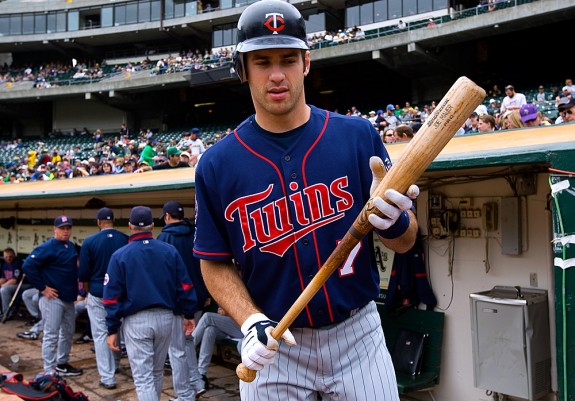 Joe Mauer #7 of the Minnesota Twins gets ready for his first at bat before the game against the Oakland Athletics at the Oakland-Alameda County Coliseum on July 22, 2009 in Oakland, California. (Photo by Brad Mangin)