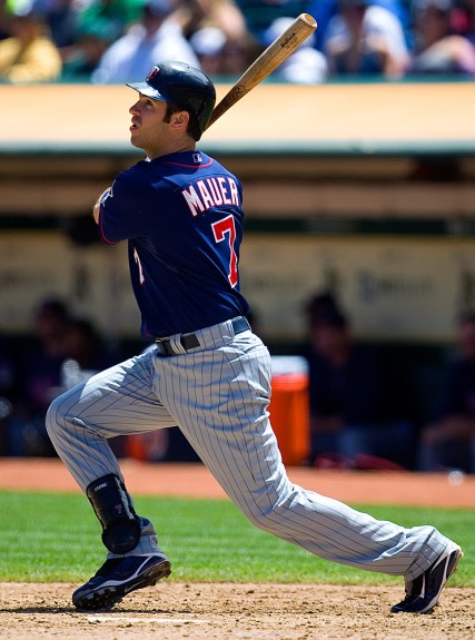 Joe Mauer #7 of the Minnesota Twins bats against the Oakland Athletics during the game at the Oakland-Alameda County Coliseum on July 22, 2009 in Oakland, California. (Photo by Brad Mangin)