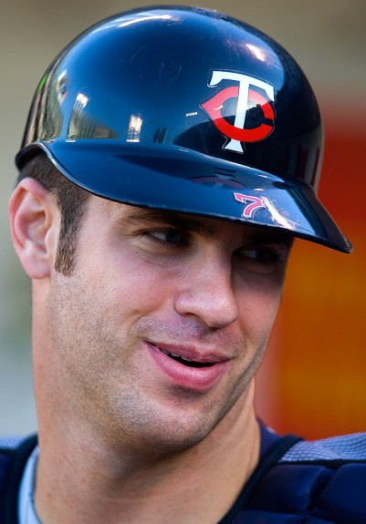 Joe Mauer of the Minnesota Twins gets ready in the dugout before the game against the Oakland Athletics at the McAfee Coliseum in Oakland, California on August 30, 2008. (Photo by Brad Mangin)