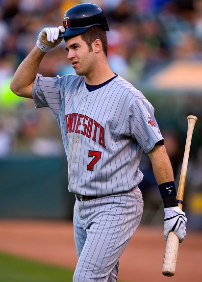 Joe Mauer of the Minnesota Twins walks to the plate for an at bat during the game against the Oakland Athletics at the McAfee Coliseum in Oakland, California on August 30, 2008. (Photo by Brad Mangin)