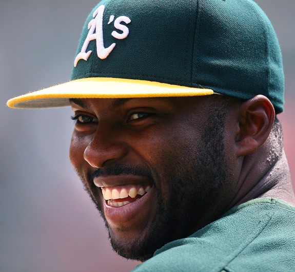 Milton Bradley of the Oakland Athletics watches batting practice before a game against the Los Angeles Angels of Anaheim at McAfee Coliseum in Oakland, CA on April 22, 2006. (Photo by Brad Mangin)