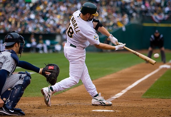 Oakland Athletics batter Jason Kendall bats during Game 3  of the ALDS against the Minnesota Twins at McAfee Coliseum in Oakland, CA on October 6, 2006. (Photo by Brad Mangin)