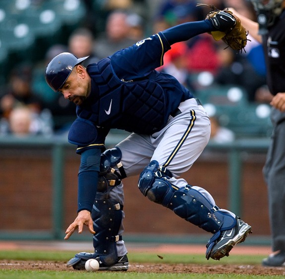  Jason Kendall of the Milwaukee Brewers picks up a bunt against the San Francisco Giants during the game at AT&T Park on April 9, 2009 in San Francisco, California. (Photo by Brad Mangin)