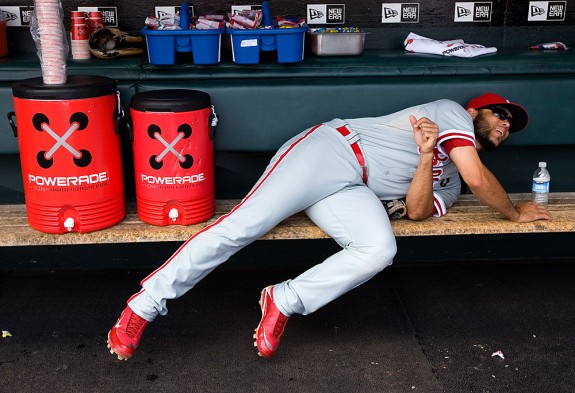 Pedro Feliz of the Philadelphia Phillies lays down to get closer to the heater in the dugout before the game against the San Francisco Giants at AT&T Park on August 2, 2009 in San Francisco, California. (Photo by Brad Mangin)