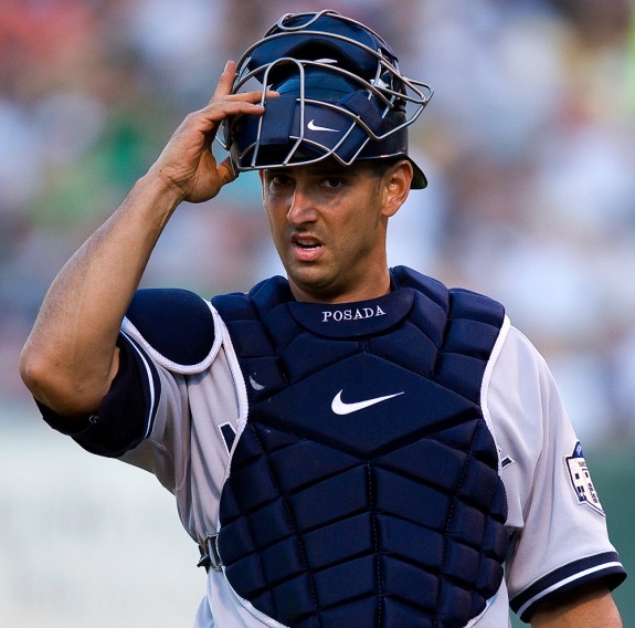 New York Yankees' Jorge Posada (20) is welcomed to the dugout