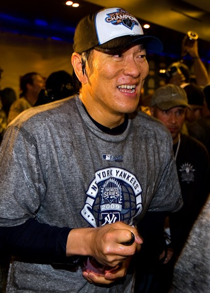 Hideki Matsui of the New York Yankees celebrates with his teammates in the victorious Yankees clubhouse after Game Six of the 2009 MLB World Series at Yankee Stadium on November 4, 2009 in New York, New York. (Photo by Brad Mangin/MLB Photos)