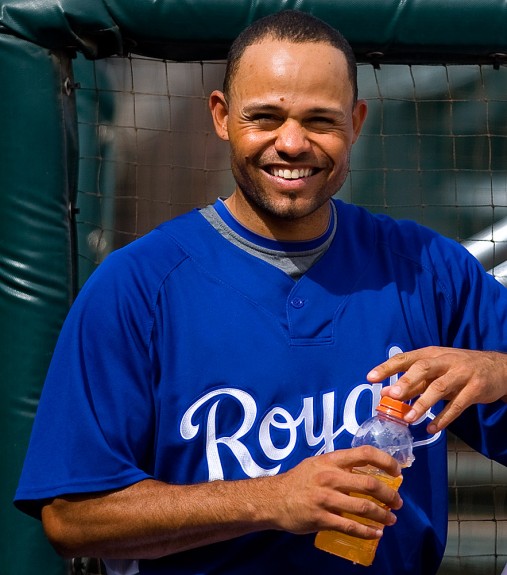 Coco Crisp of the Kansas City Royals drinks Gatorade during their spring training game against the Milwaukee Brewers at Surprise Stadium in Surprise, Arizona on March 8, 2009. (Photo by Brad Mangin)