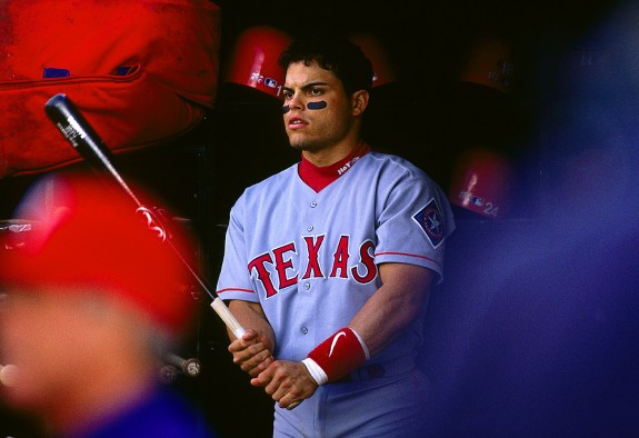 Portrait of Ivan Pudge Rodriguez of the Texas Rangers in the dugout during a game against the Oakland Athletics at the Oakland Coliseum in Oakland, California in 1997. (Photo by Brad Mangin)