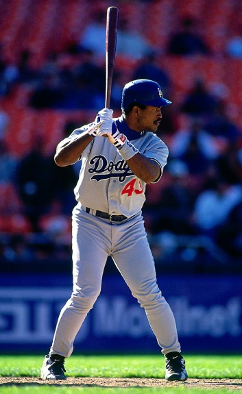 Former Los Angeles Dodger player Raul Mondesi throws out the