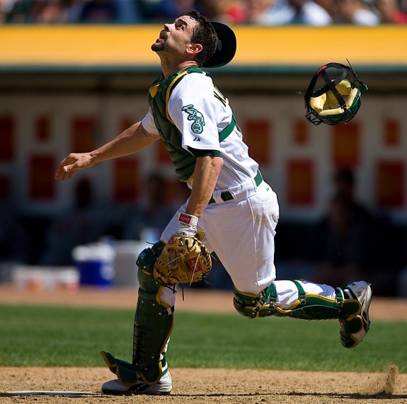 Oakland Athletics catcher Jason Kendall chases a pop up during a game against the Minnesota Twins at McAfee Coliseum in Oakland, CA on June 3, 2006. (Photo by Brad Mangin)