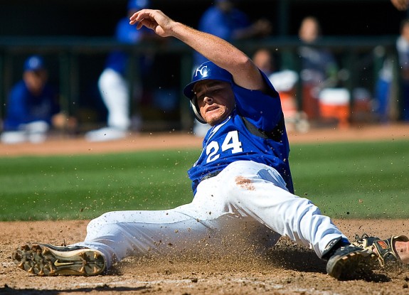 Kansas City Royals base runner Mark Teahenslides home safely against the Chicago White Sox during a spring training game in Surprise, AZ on March 16, 2005. (Photo by Brad Mangin)