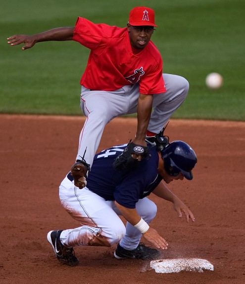 Los Angeles Angels shortstop Chone Figginsturns a double play at second base during a spring training game against the San Diego Padres at the Peoria Sports Complex in Peoria, AZ on March 3, 2005. (Photo by Brad Mangin)